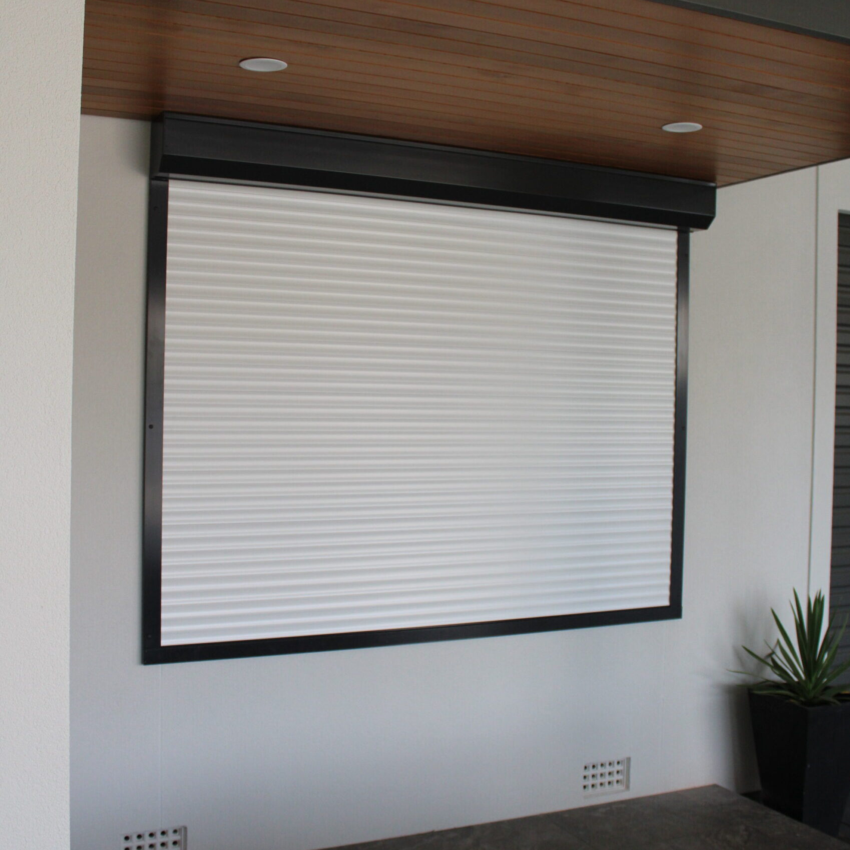 White Roller Shutters for the bedroom window